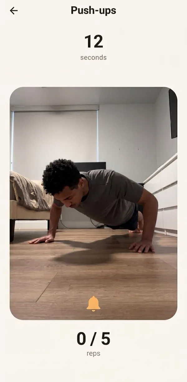 The camera counting push-ups, 0 of 5 reps